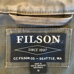 Army green, canvas, Filson jacket in medium.